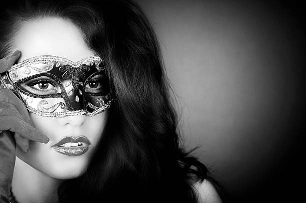 Beauty portrait of a beautiful girl wearing a mask black and white.